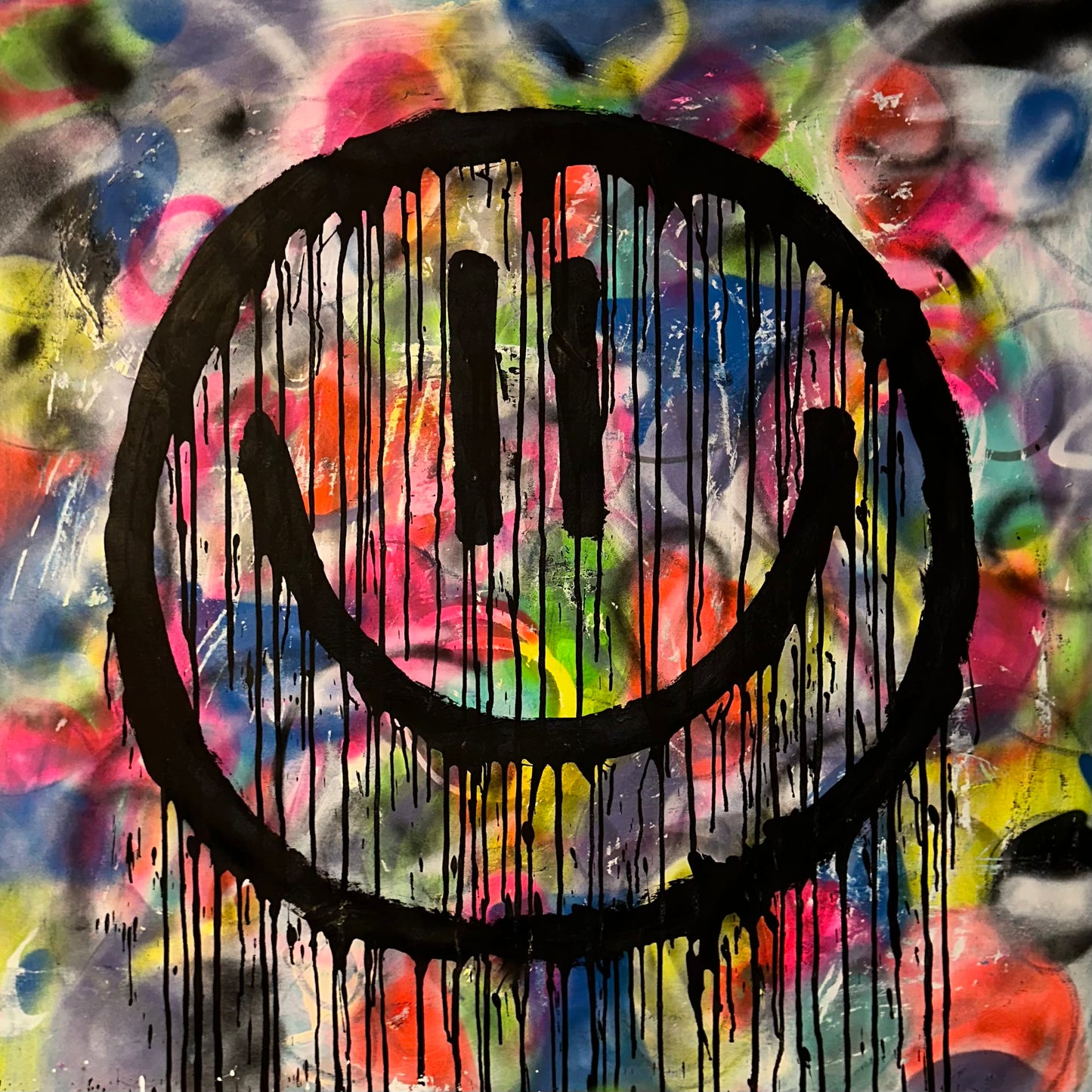 Drippy smiley on abstract color