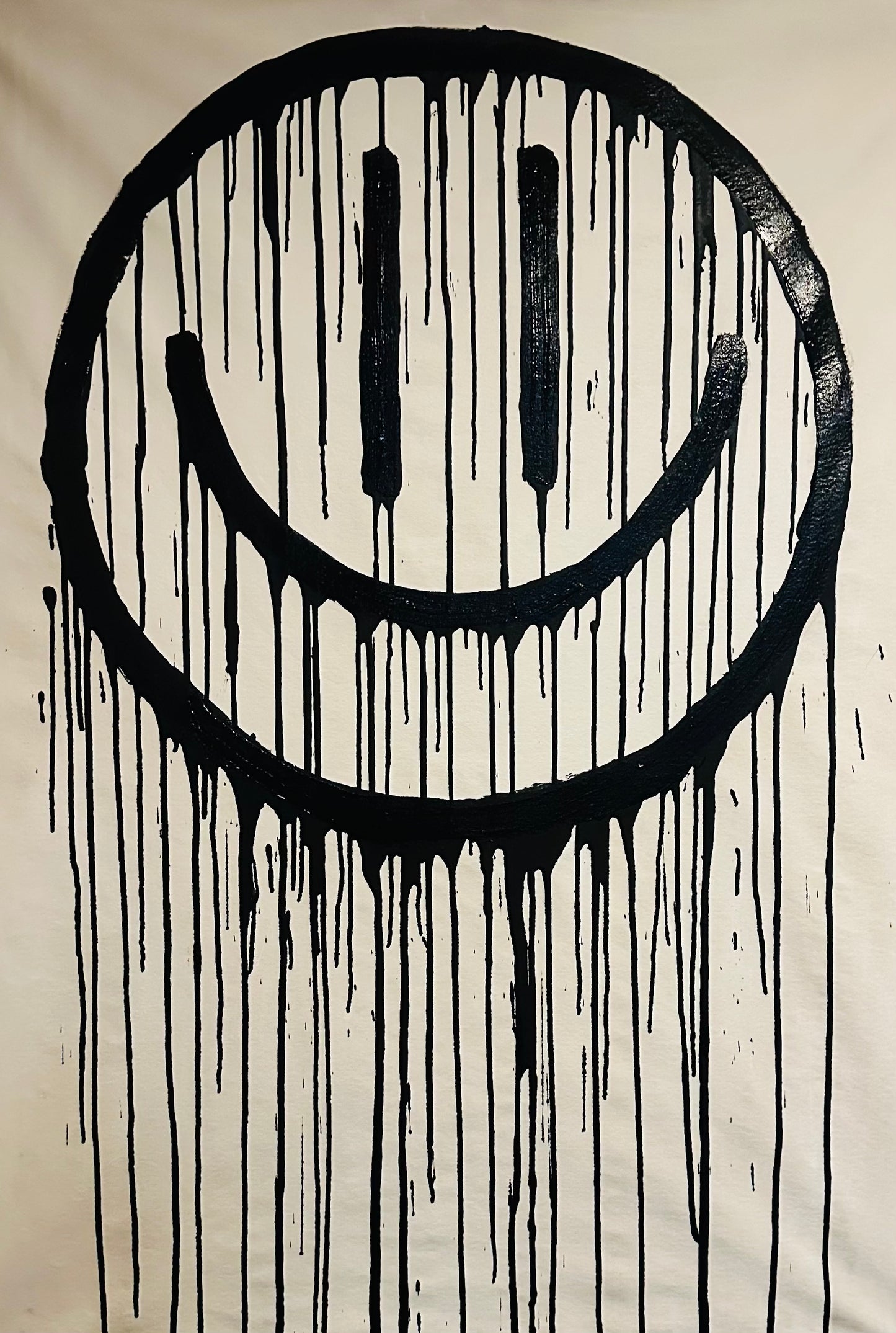 Long black drippy smiley on white