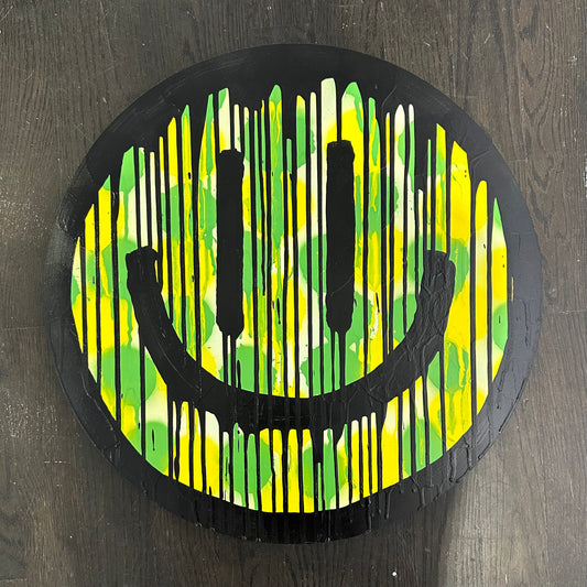Drippy smiley on yellow and green polkadots on Maplewood cut out