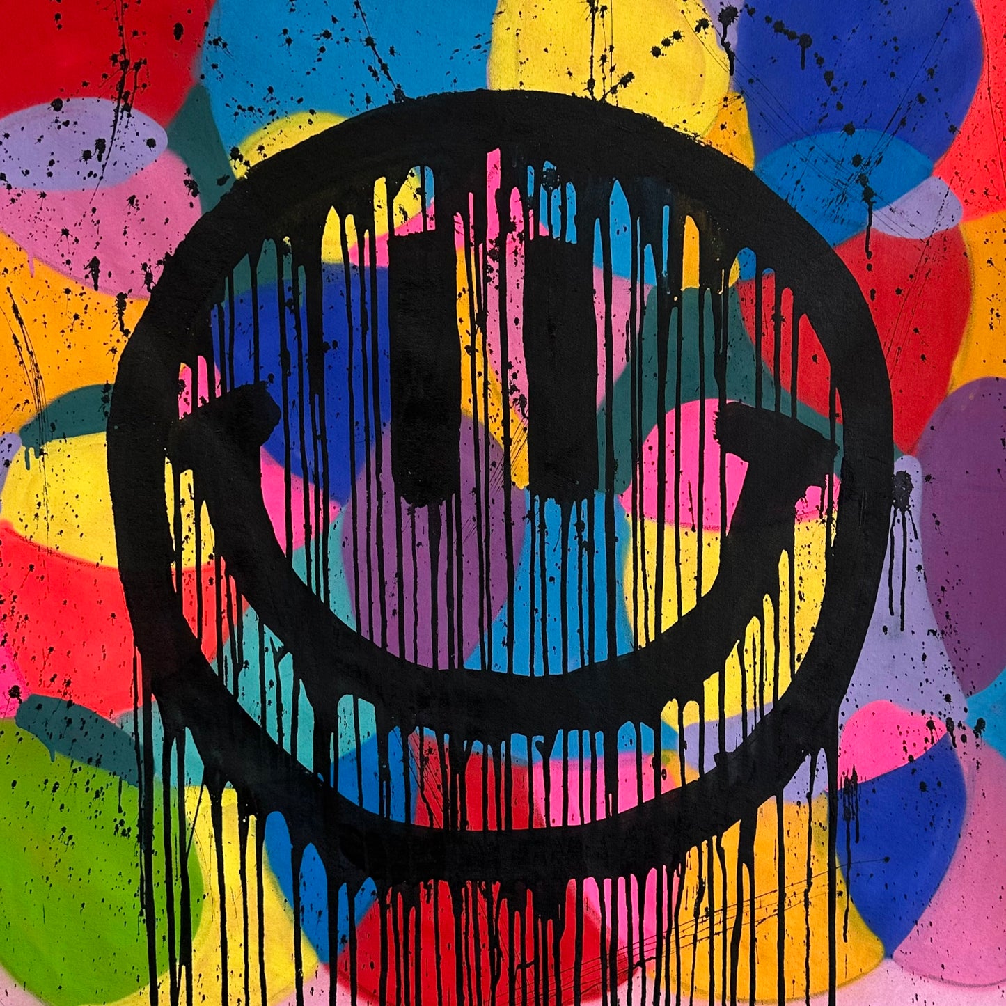 Colorful smiley on pink with drips