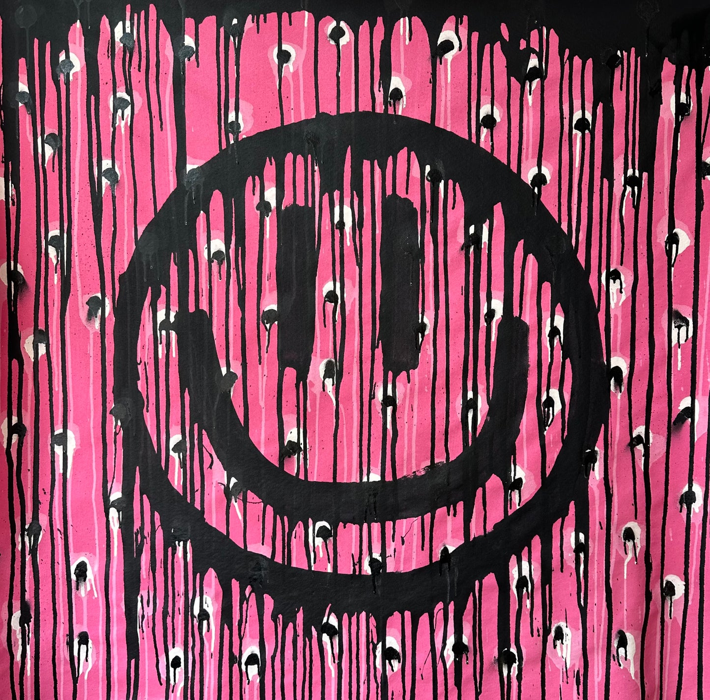 Black and white polkadots on pink, drippy smiley