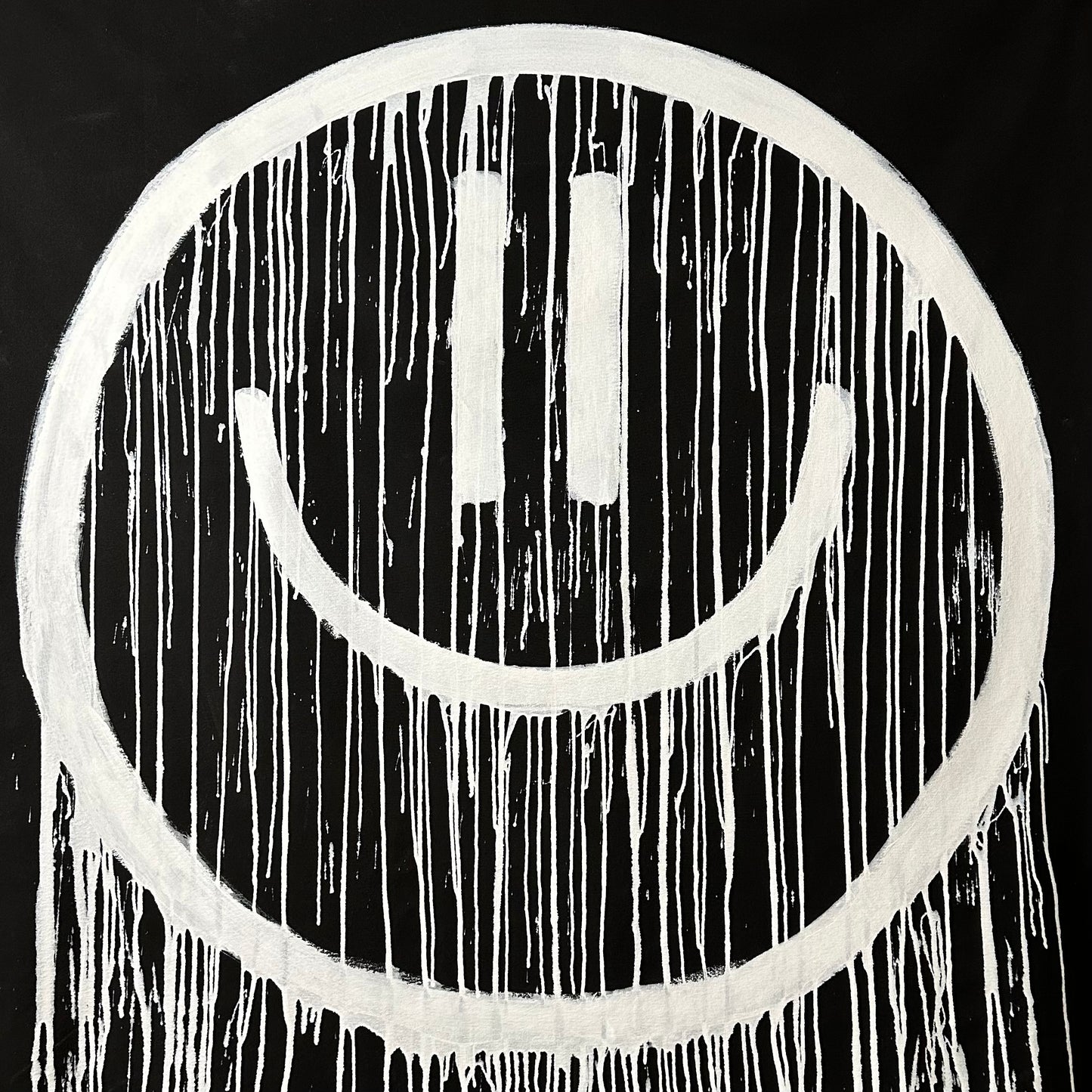 White drippy smiley on black